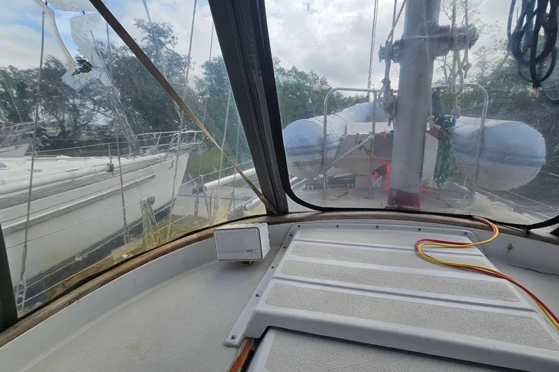 Slide: The Image of Interior view of a 1982 Morgan 462 sailboat cockpit with a clear canopy. - 28