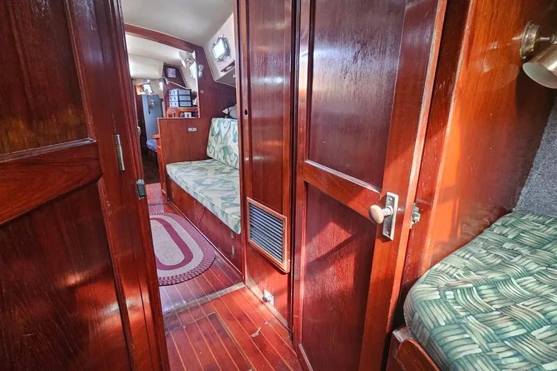 Slide: The Image of Interior of 1982 Morgan 462 yacht with wooden paneling and cushioned seating. - 43