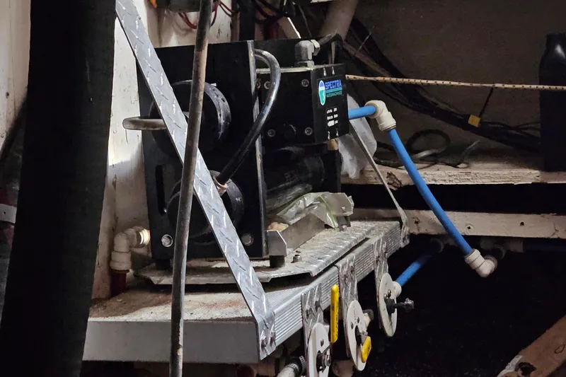 Slide: The Image of Engine room of a 1982 Morgan 462 yacht with mechanical equipment and piping. - 51