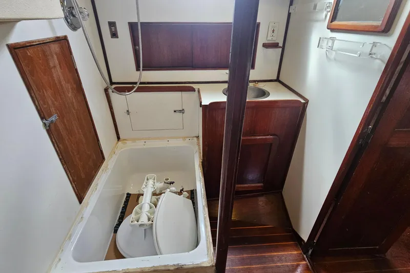 Slide: The Image of 1982 Morgan 462 yacht bathroom with wooden cabinetry and compact sink. - 60