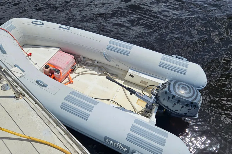 Slide: The Image of Inflatable boat with outboard motor on water, featuring a Morgan 462, 1982 model. - 69