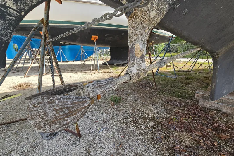 Slide: The Image of 1982 Morgan 462 sailboat propeller with marine growth, on stands for maintenance. - 8