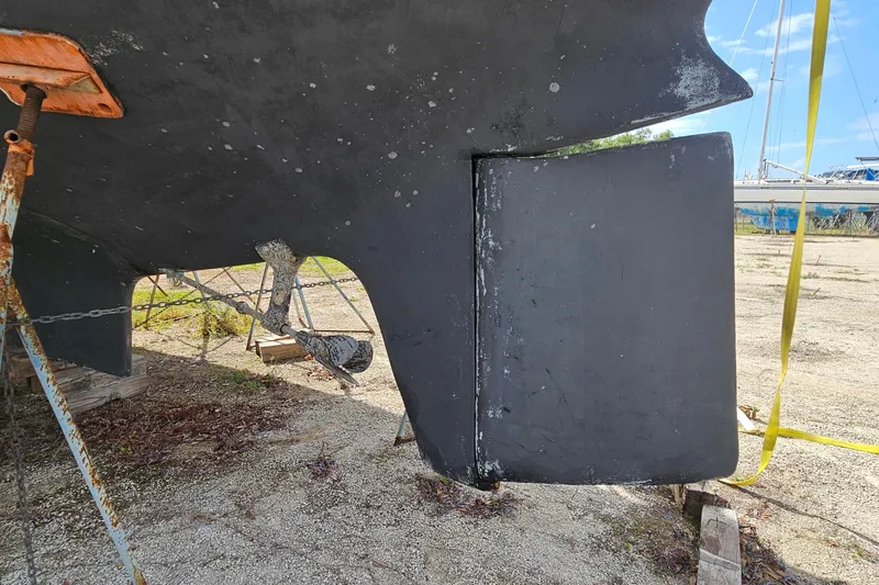 Slide: The Image of 1982 Morgan 462 sailboat rudder and keel on dry dock. - 9