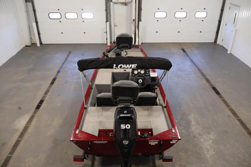 Slide: The Image of 2022 Tracker Pro 170 boat in a garage, featuring a Mercury 50 engine. - 10