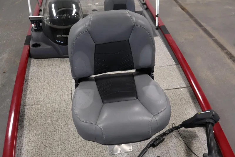 Slide: The Image of 2022 Tracker Pro 170 boat interior with gray seating and steering console. - 15