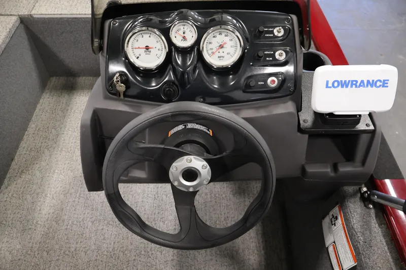 Slide: The Image of Steering console of 2022 Tracker Pro 170 boat with gauges and Lowrance device. - 18