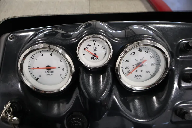 Slide: The Image of Dashboard gauges of a 2022 Tracker Pro 170 boat, showing RPM, fuel, and speed. - 19