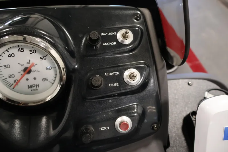 Slide: The Image of Dashboard controls of a 2022 Tracker Pro 170 boat, featuring speedometer and switches. - 20