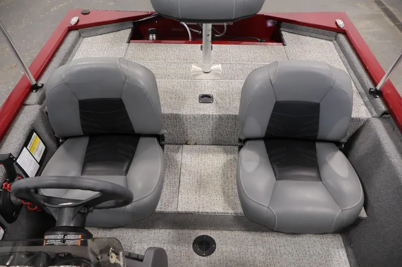 Slide: The Image of 2022 Tracker Pro 170 boat interior with gray seats and steering wheel. - 25