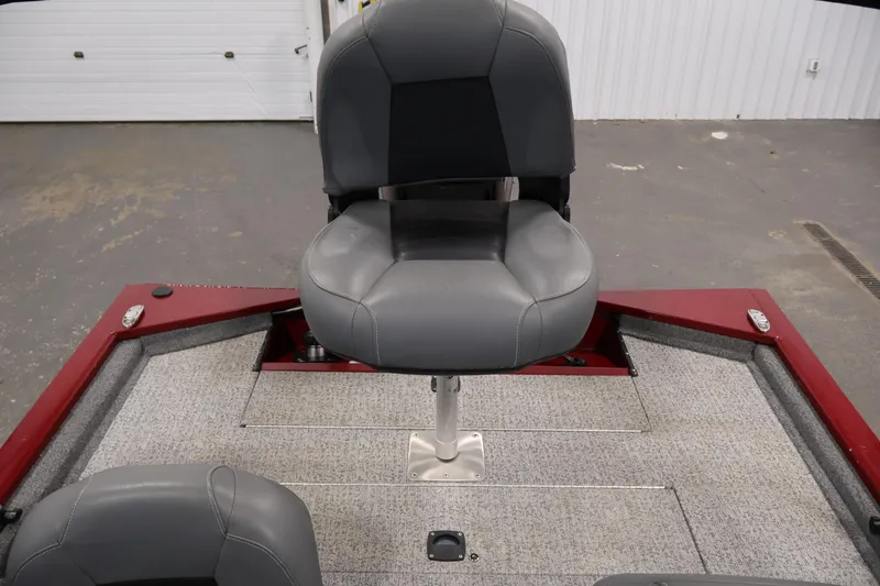 Slide: The Image of 2022 Tracker Pro 170 boat interior with gray seating and red accents. - 26
