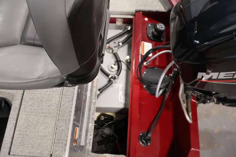 Slide: The Image of Interior view of a 2022 Tracker Pro 170 boat showing seating and engine components. - 28