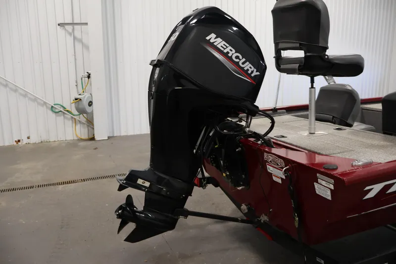 Slide: The Image of 2022 Tracker Pro 170 boat with Mercury outboard motor in a garage setting. - 29