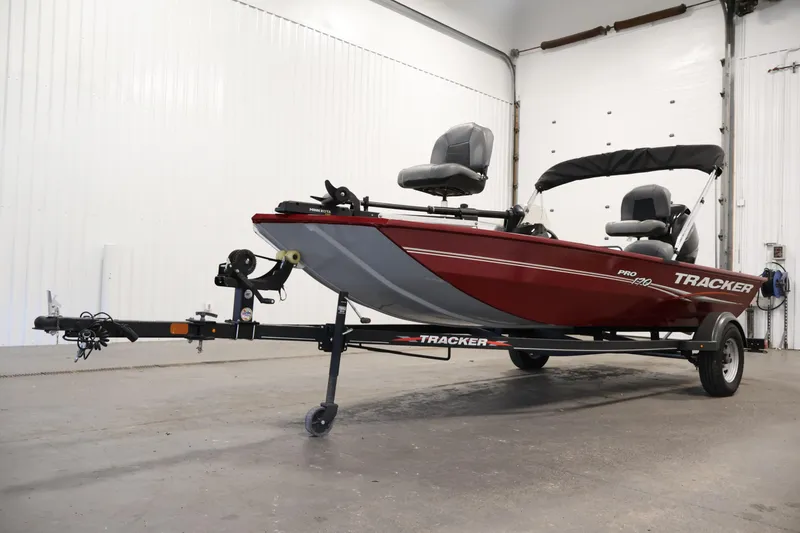 Slide: The Image of 2022 Tracker Pro 170 boat on trailer in a garage setting. - 34