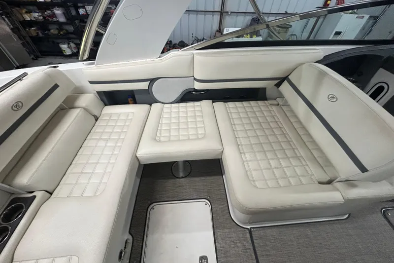 Slide: The Image of 2017 Cobalt R30 boat interior with white cushioned seating and modern design. - 15