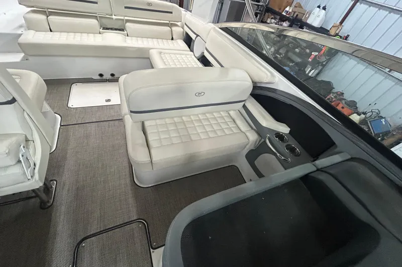 Slide: The Image of Interior of a 2017 Cobalt R30 boat with white cushioned seating. - 17