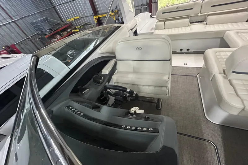 Slide: The Image of Interior of a 2017 Cobalt R30 boat, featuring luxurious seating and modern controls. - 18