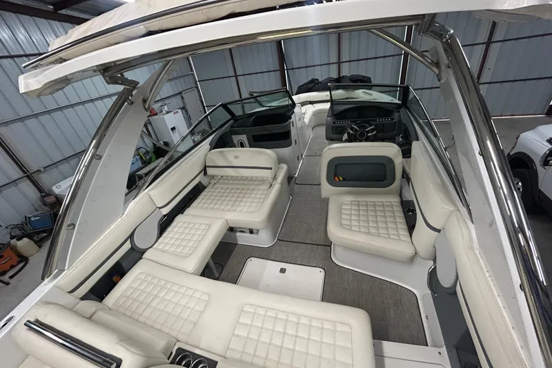 Slide: The Image of 2017 Cobalt R30 boat interior with white seating and modern dashboard. - 20