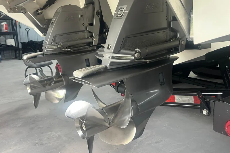 Slide: The Image of Dual propellers on a 2017 Cobalt R30 boat in a garage setting. - 22
