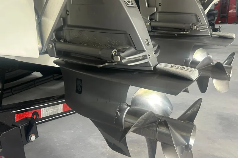 Slide: The Image of Close-up of 2017 Cobalt R30 boat propellers in a garage setting. - 23