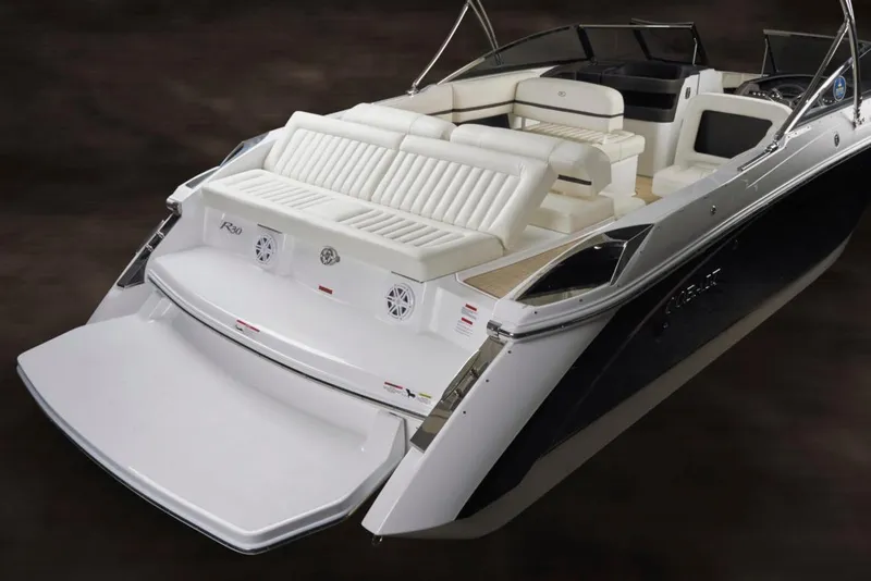 Slide: The Image of Manufacturer Provided Image: 2017 Cobalt R30 boat dashboard with steering wheel and navigation screens. - 8