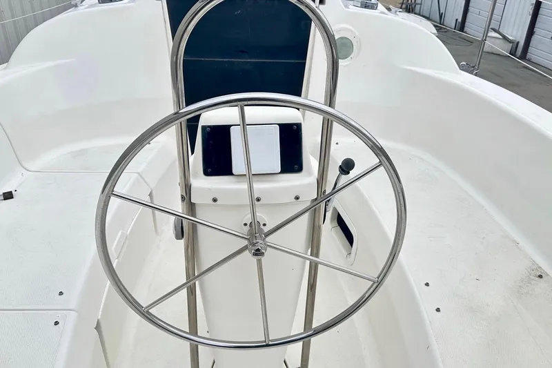 Slide: The Image of Steering wheel of a 1996 Hunter Marine 280 sailboat cockpit. - 11