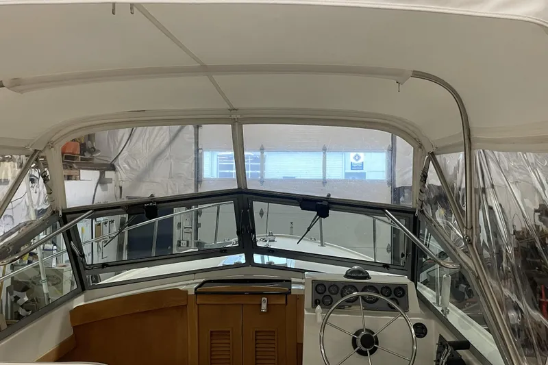 Slide: The Image of Interior view of a 1993 Limestone Express boat cockpit with steering wheel and dashboard. - 3