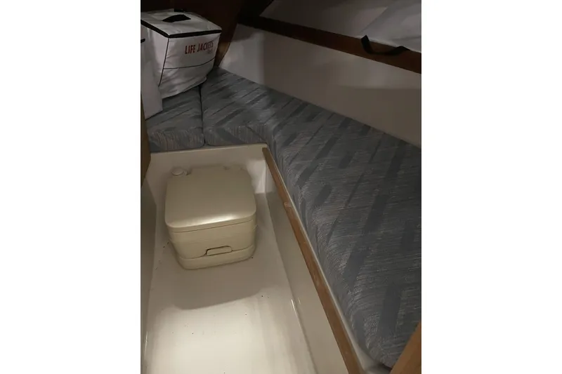 Slide: The Image of Interior of 1993 Limestone Express boat with seating and portable toilet. - 4