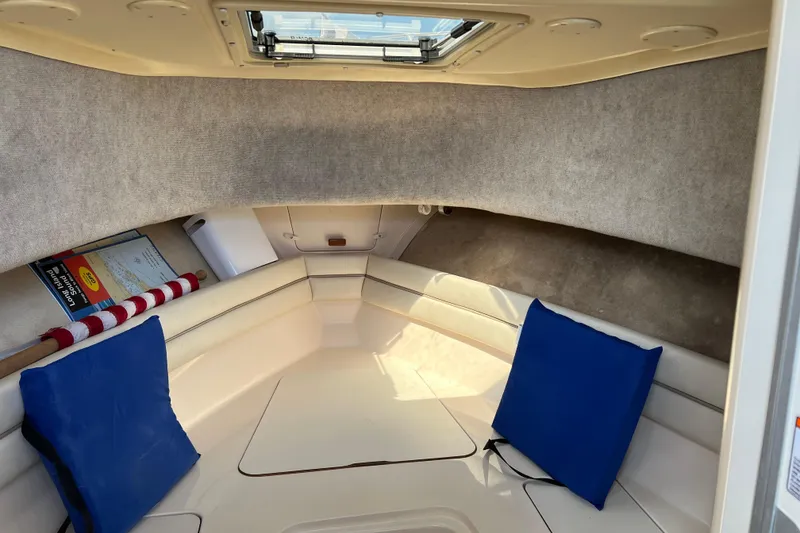 Slide: The Image of Interior cabin of 2005 Grady-White Islander 270 boat with cushions and hatch. - 11
