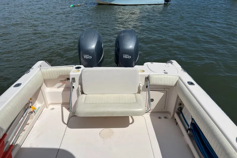 Slide: The Image of 2005 Grady-White Islander 270 boat with twin Yamaha 150 engines on water. - 5