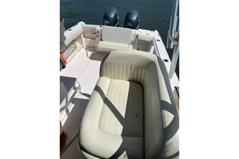 Slide: The Image of 2005 Grady-White Islander 270 boat interior with seating and dual engines. - 6