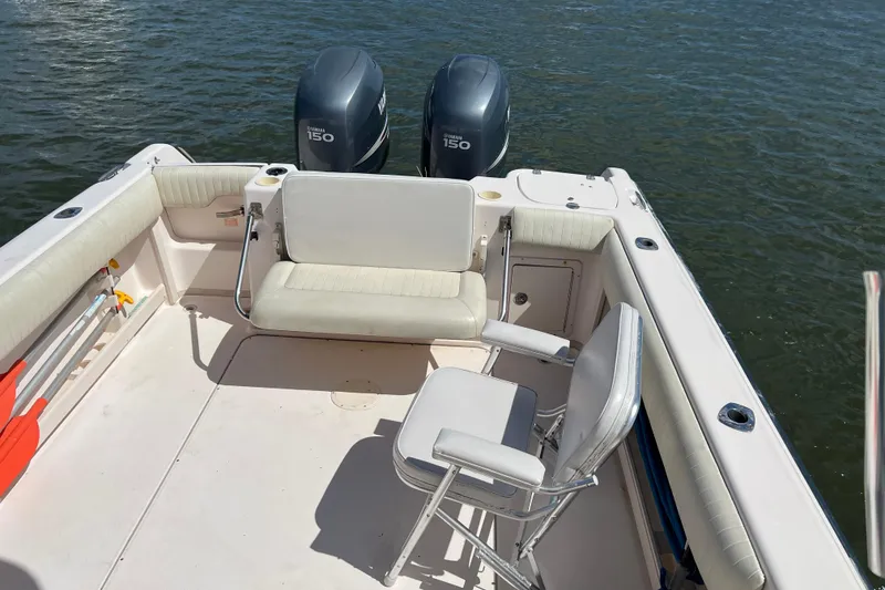 Slide: The Image of 2005 Grady-White Islander 270 boat interior with seating and twin Yamaha 150 engines. - 7