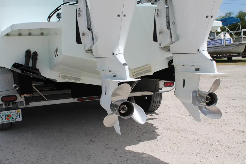Slide: The Image of 2015 Stamas Americana 26 boat with dual outboard motors on a trailer. - 6