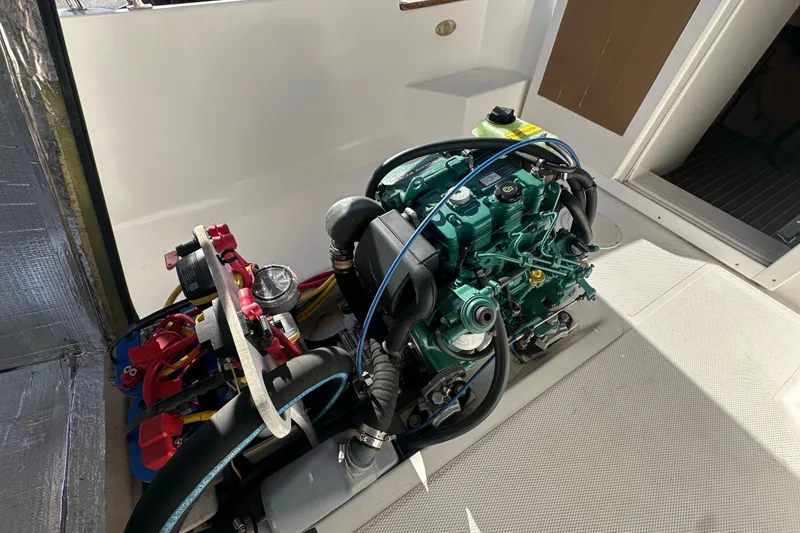 Slide: The Image of Engine compartment of a 2015 Ranger Tugs R-21 EC boat, showcasing detailed machinery. - 14