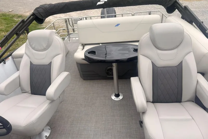 Slide: The Image of Interior of 2023 Starcraft SLS 3 boat with plush seating and a central table. - 2