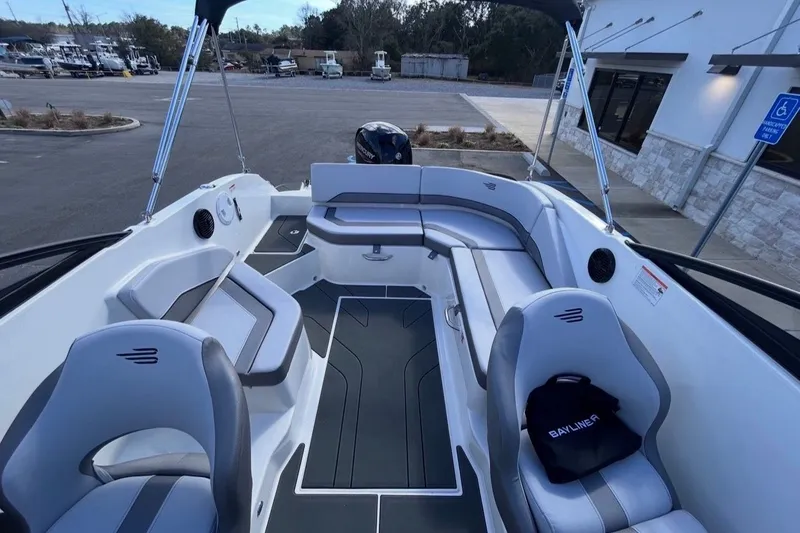 Slide: The Image of Interior of 2026 Bayliner V20 boat with gray seating. - 11