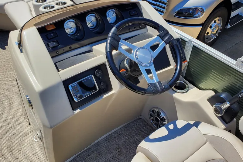 Slide: The Image of Steering console of a 2019 Bennington SX 23 SPDXP pontoon boat with gauges and controls. - 12