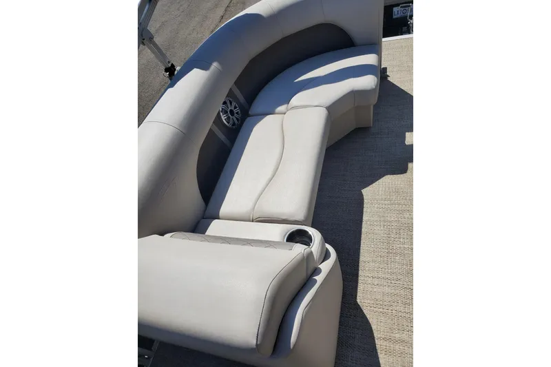 Slide: The Image of 2019 Bennington SX 23 SPDXP boat interior with beige seating and cup holders. - 15