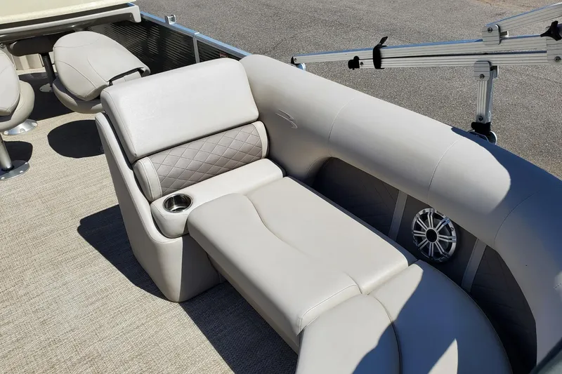 Slide: The Image of Luxurious seating on a 2019 Bennington SX 23 SPDXP pontoon boat with cup holder and speaker. - 21