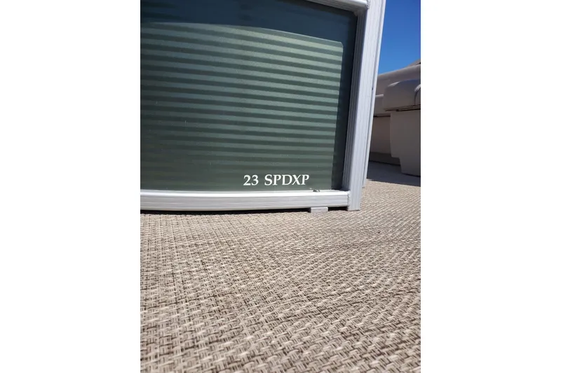 Slide: The Image of 2019 Bennington SX 23 SPDXP pontoon boat deck with textured flooring. - 5