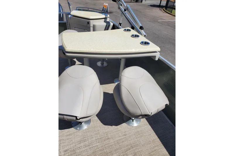 Slide: The Image of 2019 Bennington SX 23 SPDXP boat interior with table and seating arrangement. - 9