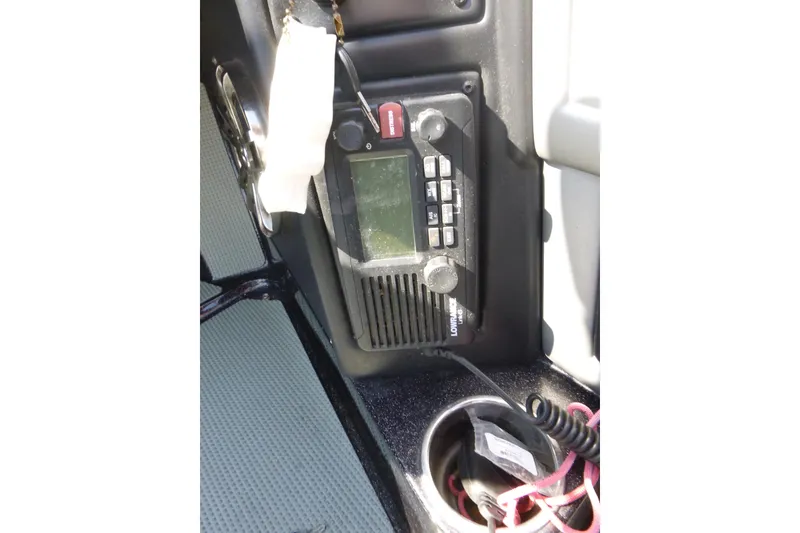 Slide: The Image of 2019 Ranger 620FS Fisherman boat interior with marine radio and cup holder. - 15