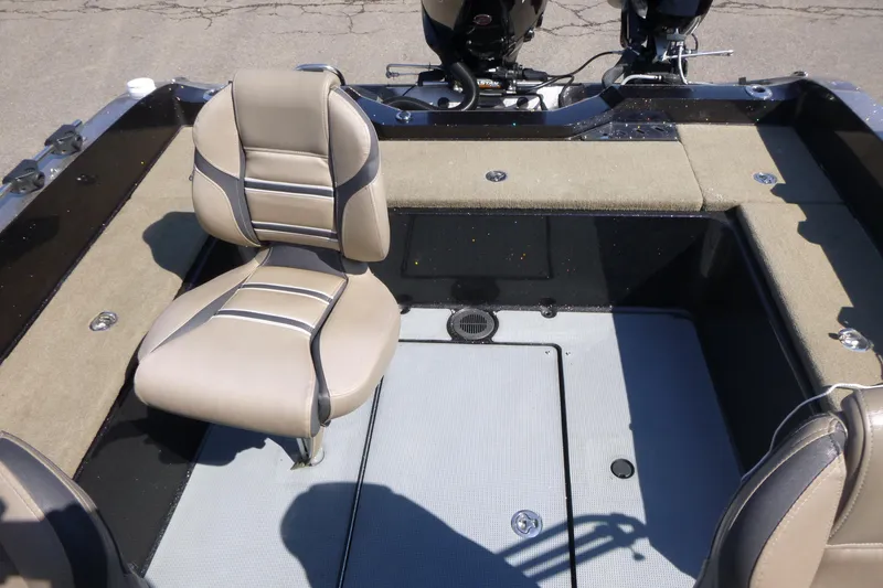 Slide: The Image of 2019 Ranger 620FS Fisherman boat interior with beige seating and storage compartments. - 17