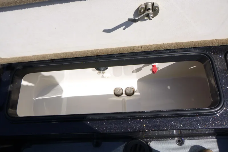 Slide: The Image of Open storage compartment in 2019 Ranger 620FS Fisherman boat. - 18