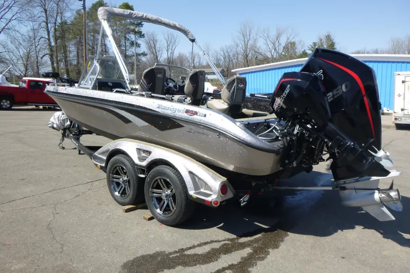 Slide: The Image of 2019 Ranger 620FS Fisherman boat on trailer with powerful outboard motor. - 5