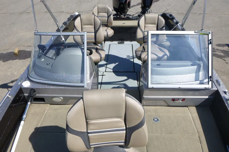 Slide: The Image of 2019 Ranger 620FS Fisherman boat interior with seating and windshield. - 7