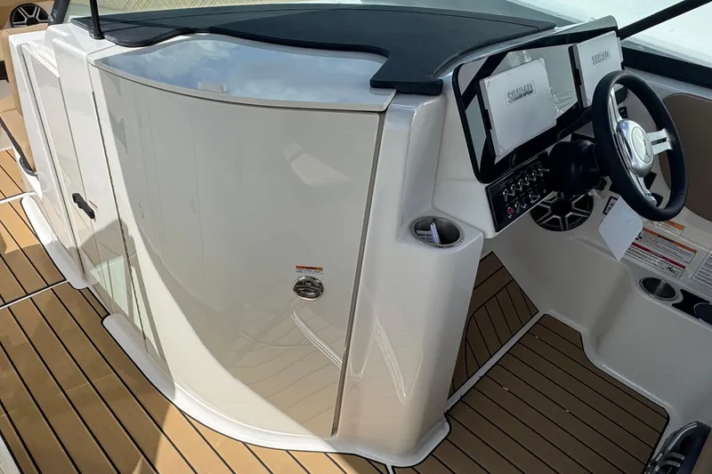 Slide: The Image of 2026 Sea Ray SDX 250 Outboard helm with modern controls and sleek design. - 34