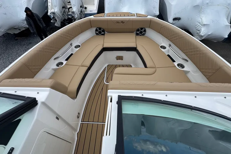 Slide: The Image of 2026 Sea Ray SDX 250 Outboard boat with luxurious tan seating and sleek design. - 37