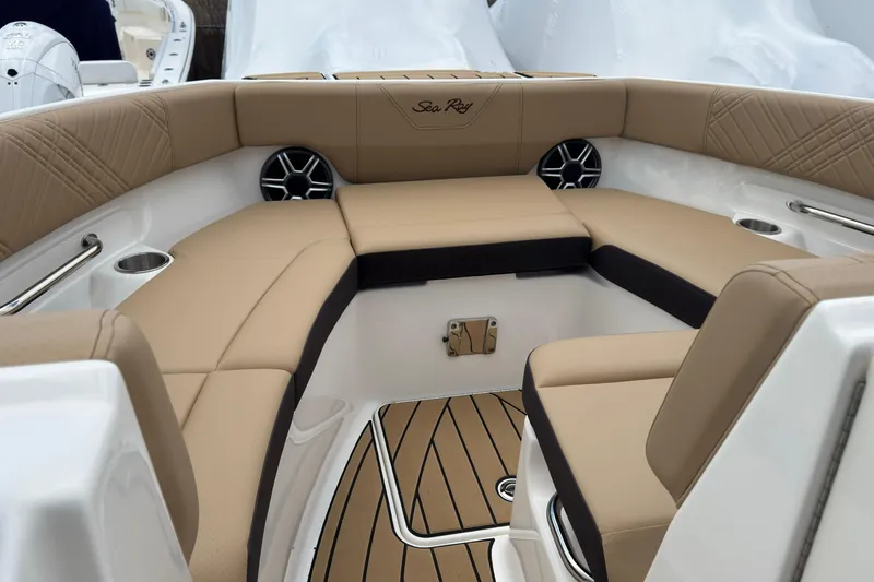 Slide: The Image of 2026 Sea Ray SDX 250 Outboard boat interior with tan seating and stylish design. - 41
