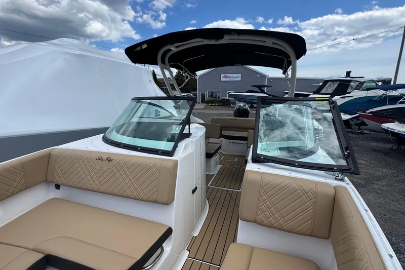 Slide: The Image of 2026 Sea Ray SDX 250 Outboard boat with tan seating and sleek design. - 45