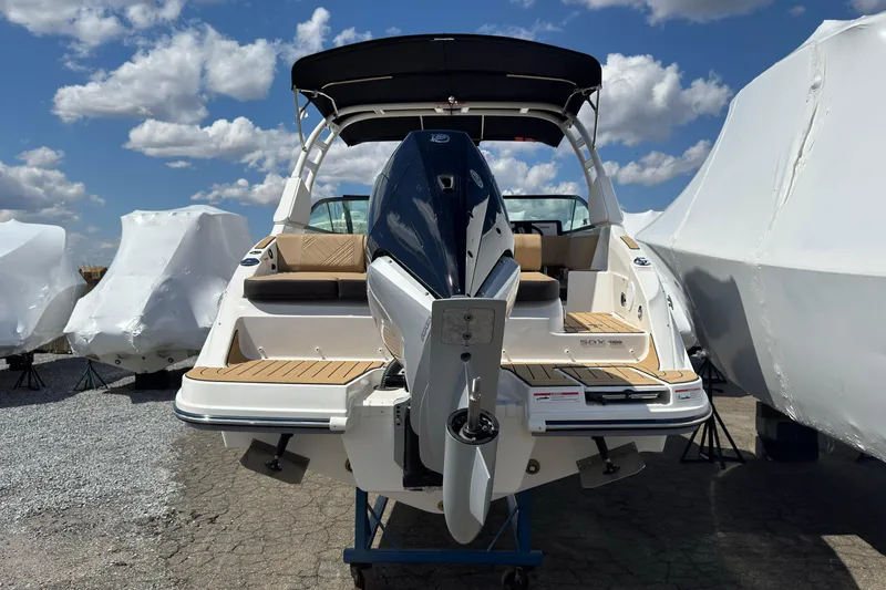Slide: The Image of 2026 Sea Ray SDX 250 Outboard boat displayed outdoors under a blue sky. - 5